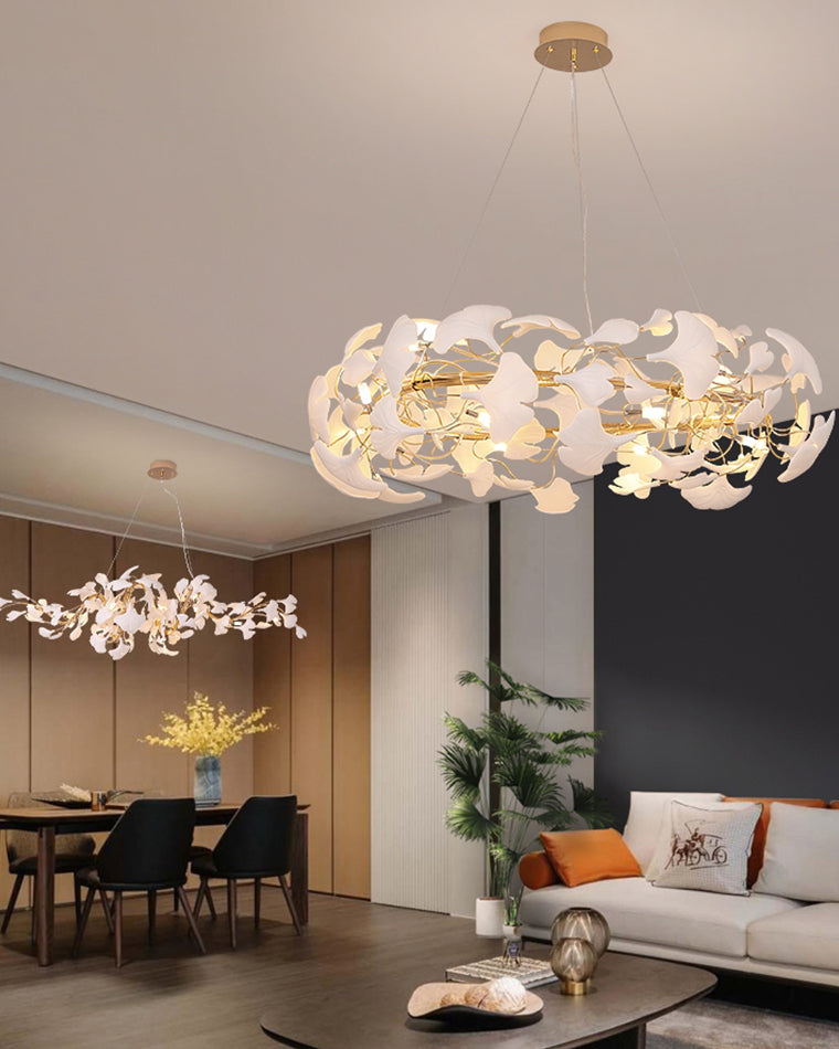 Nature-inspired chandelier in an open living and dining room, with white ceramic leaves forming a rounded canopy above the seating area.