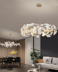Alternate open-room view of the white leaf chandelier, showing its scale beside coordinated lighting over the dining table.