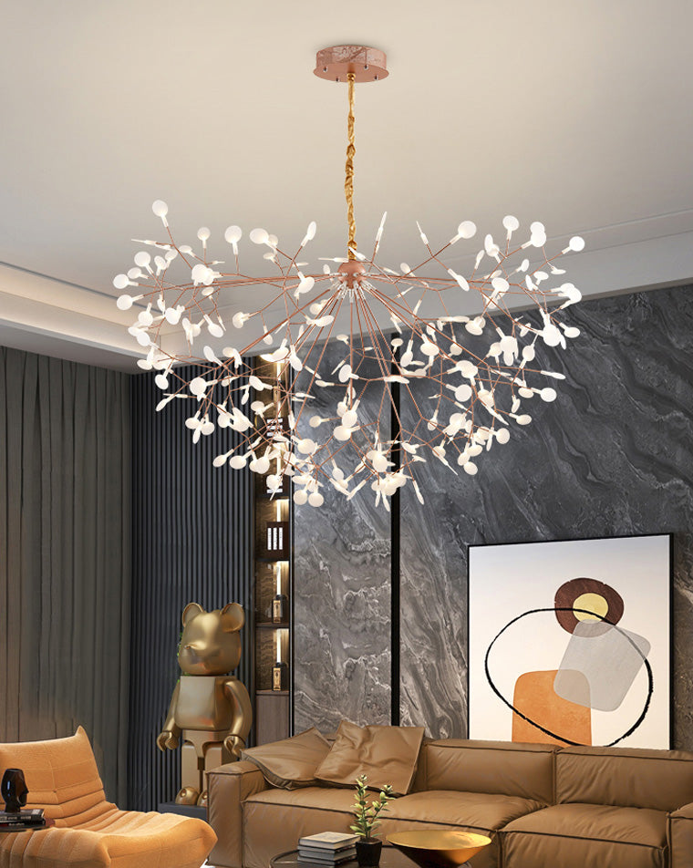 Heracleum firefly chandelier glowing above a moody living room, turning the high ceiling into a warm constellation of light.