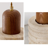 Close-up of porous natural stone, rounded ribbing and walnut grain on a travertine pendant light.