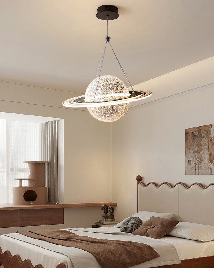 Large modern globe pendant light with a textured translucent sphere and bright orbit ring above a warm beige bedroom.