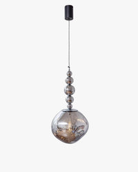 Silver five-sphere globe pendant light with mirrored metal orbs descending into an irregular acrylic globe beneath a black ceiling canopy.