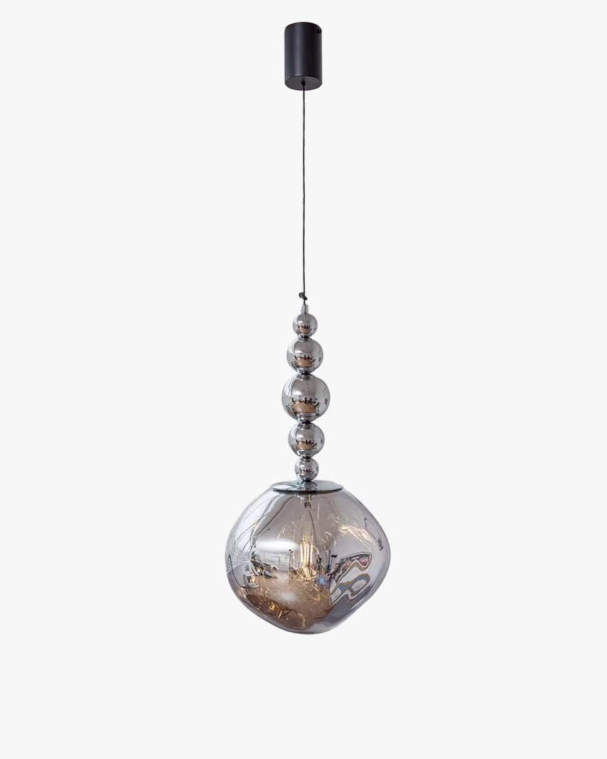 Silver five-sphere globe pendant light with mirrored metal orbs descending into an irregular acrylic globe beneath a black ceiling canopy.
