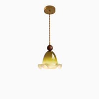 Amber moss glass pendant light with a luminous ruffled bell shade, dark brown spherical accent and warm gold-toned ceiling canopy.