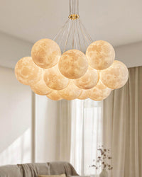 Close view of a modern thirteen-light bubble chandelier with textured cream-white PLA globes arranged in a broad illuminated cluster.