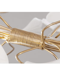 Close-up of the WM2419 chandelier’s bundled gold-toned branches, showing the sculptural framework beneath the ceramic leaf canopy.