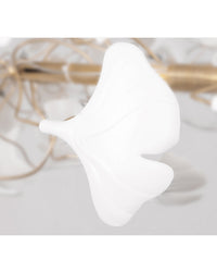 Single sculpted white ceramic ginkgo leaf in close-up, showing the curved form and soft surface used across the WM2419 chandelier.