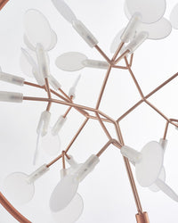 Interlaced rose-gold branches and glowing leaves viewed from below, giving the modern organic chandelier surprising depth, movement, and firefly-like beauty.