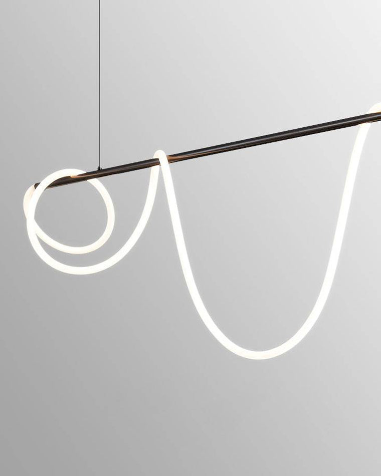Close view of a matte-black LED linear chandelier with the illuminated silicone rope wrapped into loose loops around the suspended bar.