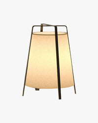 Short beige paper lantern floor lamp with a black metal frame and warm ambient glow.