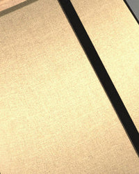 Close-up of the glowing paper shade showing warm white light through the textured surface.
