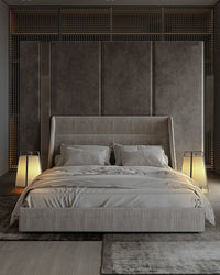 Two lantern floor lamps used as floor-level bedside lights on both sides of a bed.