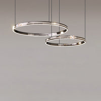 Illuminated Ø24″+31″ modern chandelier with wider offset rings, giving larger interiors a stronger but still uncluttered focal point.