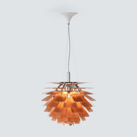 Copper pinecone pendant light with layered metal shades and a warm glow, shown on a clean product background.