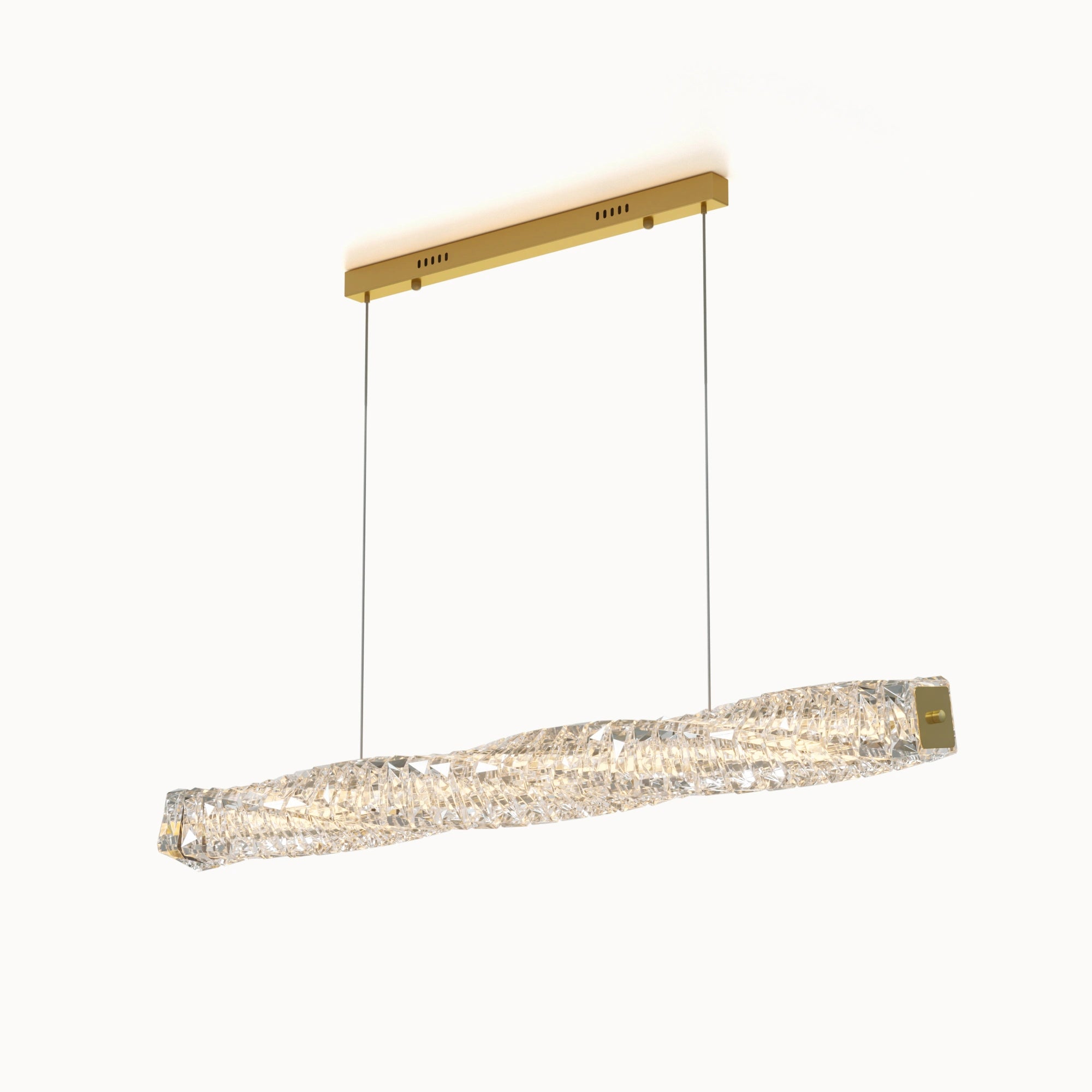 WOMO WM2193 linear crystal chandelier in gold, with a sculptural twisted crystal bar, rectangular canopy and two suspension cables on a white background.