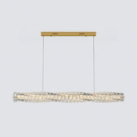 Front view of a gold linear crystal chandelier with two suspension cables and a gently twisted crystal bar.