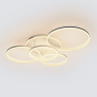 A soft white overhead lighting fixture with five circular LED rings, bringing gentle brightness to bedrooms, lounges, or relaxed family spaces.
