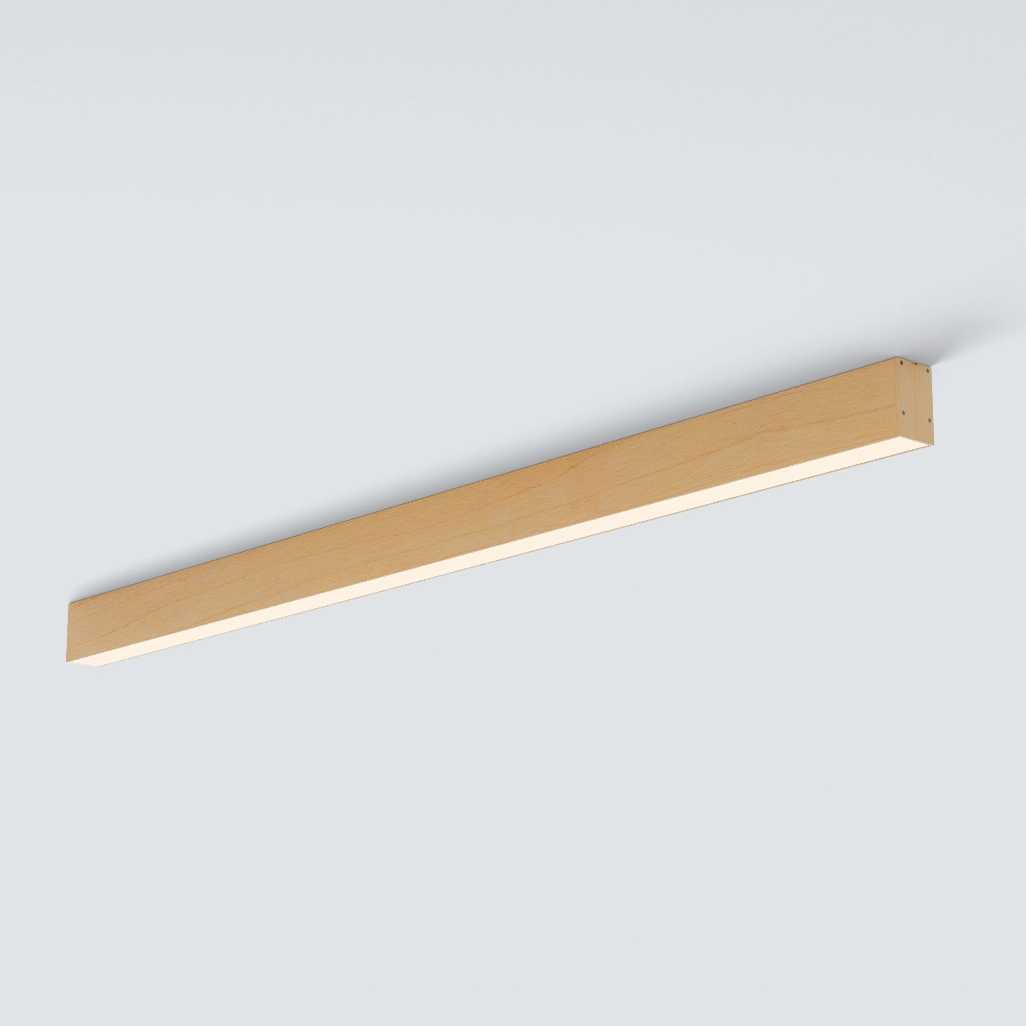 A modern linear LED ceiling light fixture with a natural light wood finish, shown mounted against a plain light gray wall.