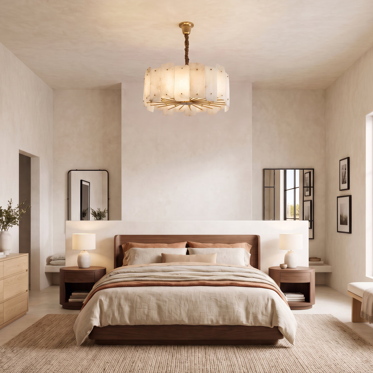 WOMO WM2391 alabaster drum-shaped chandelier above a bed framed by wall art and matching bedside lamps.