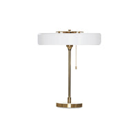 White led table lamp with a wide circular metal shade, gold-tone frame, round base and hanging pull chain.