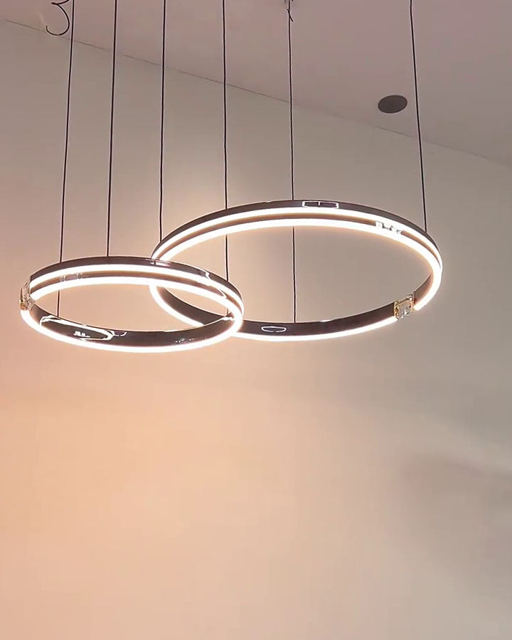 Integrated led lamp in warm-light mode, softening the black rings for relaxed dining and evening living.